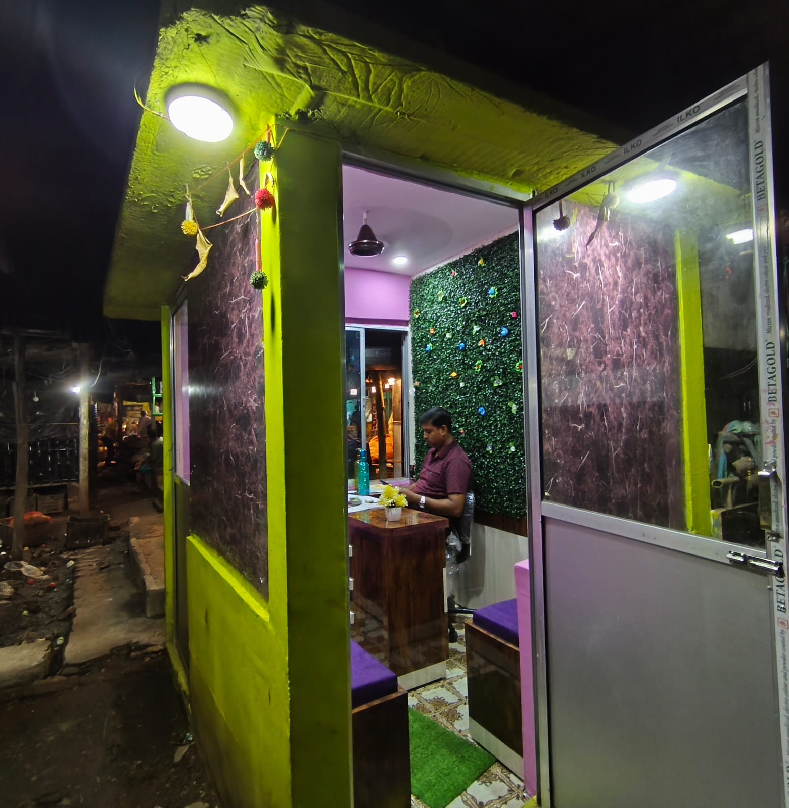 Anu Tour and Travels booking office at night